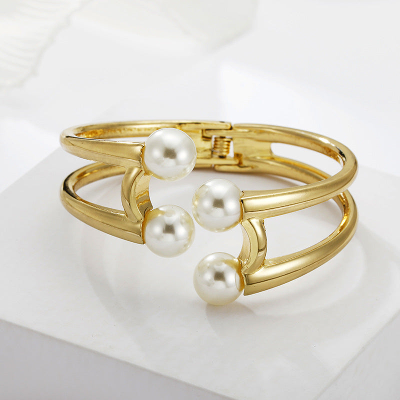 Mystique Pearl Bracelet - Exquisite Metal Bangle with Edgy Charm