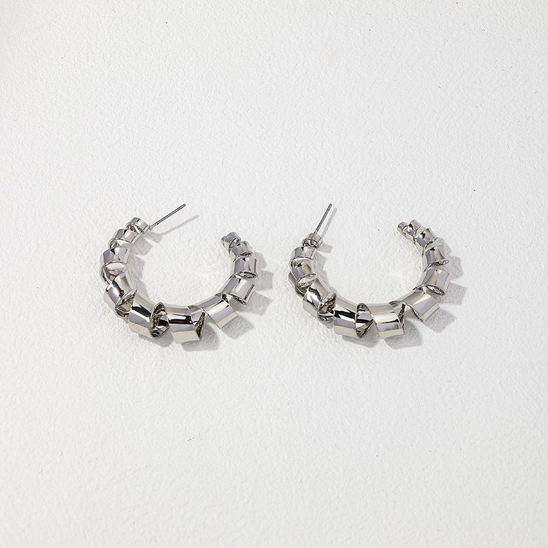 Exaggerated Elastic Geometric Earrings with a Twist