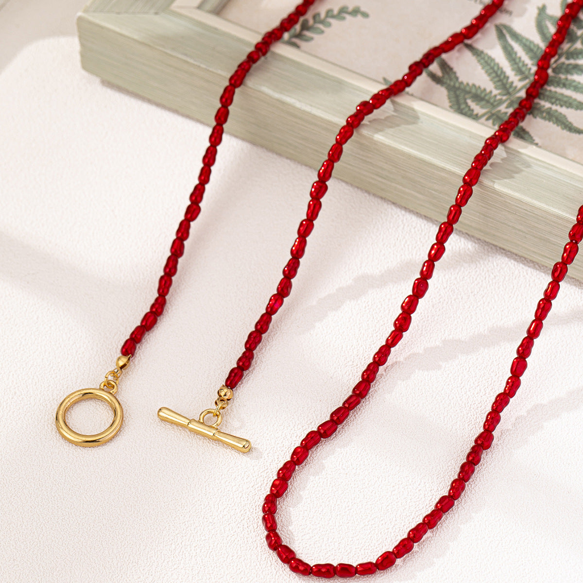 Planderful Vienna Verve Necklace Set – Stylish Red Pearl Design