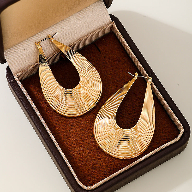 Planderful Vienna Verve Earrings – Exaggerated Metal Hollow Water Drop Design