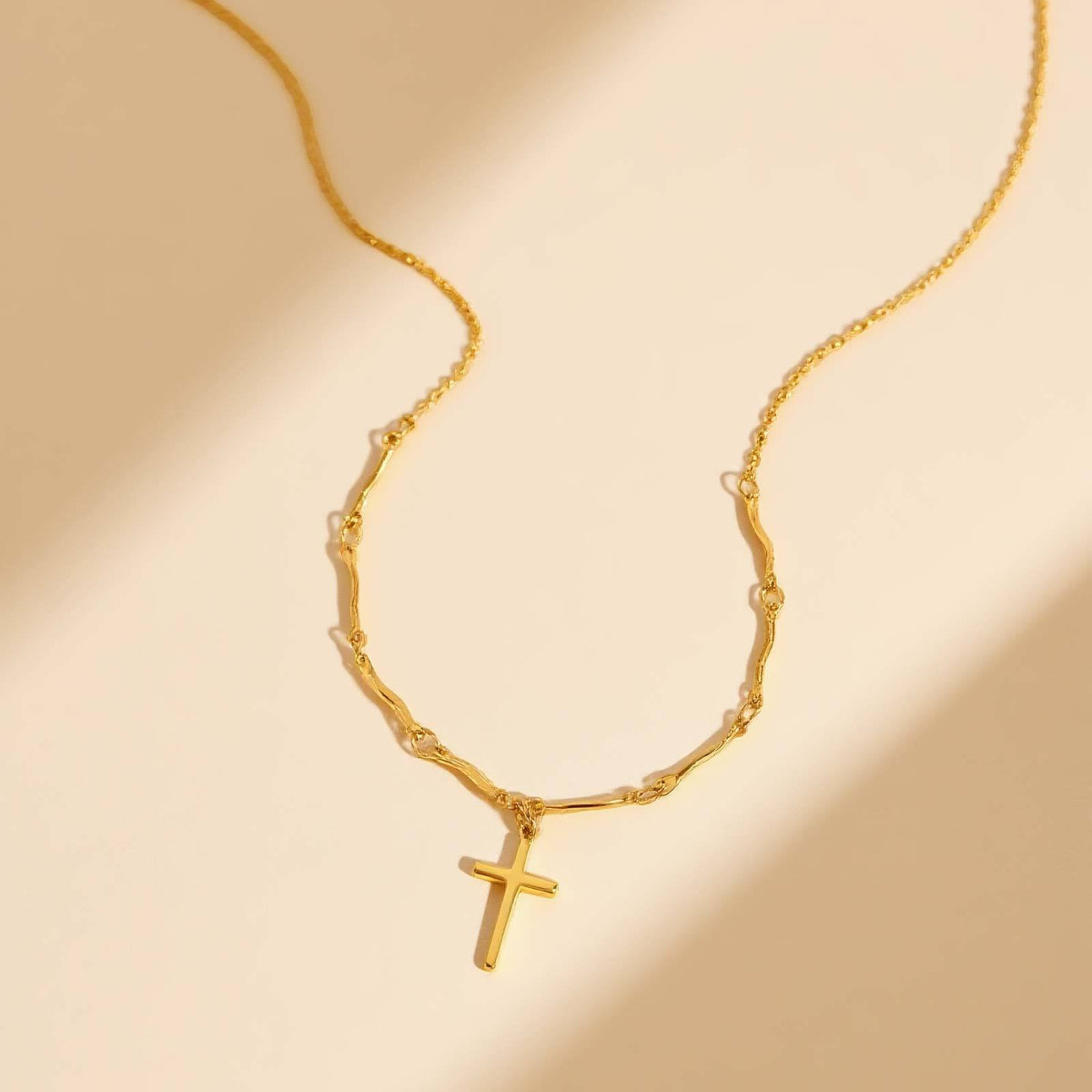 Delicate Gold Cross Necklace with Wavy Links