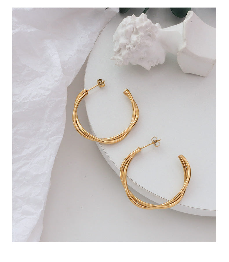 Golden Twist Cross Earrings with Titanium Finish - Unique Genie Collection Piece