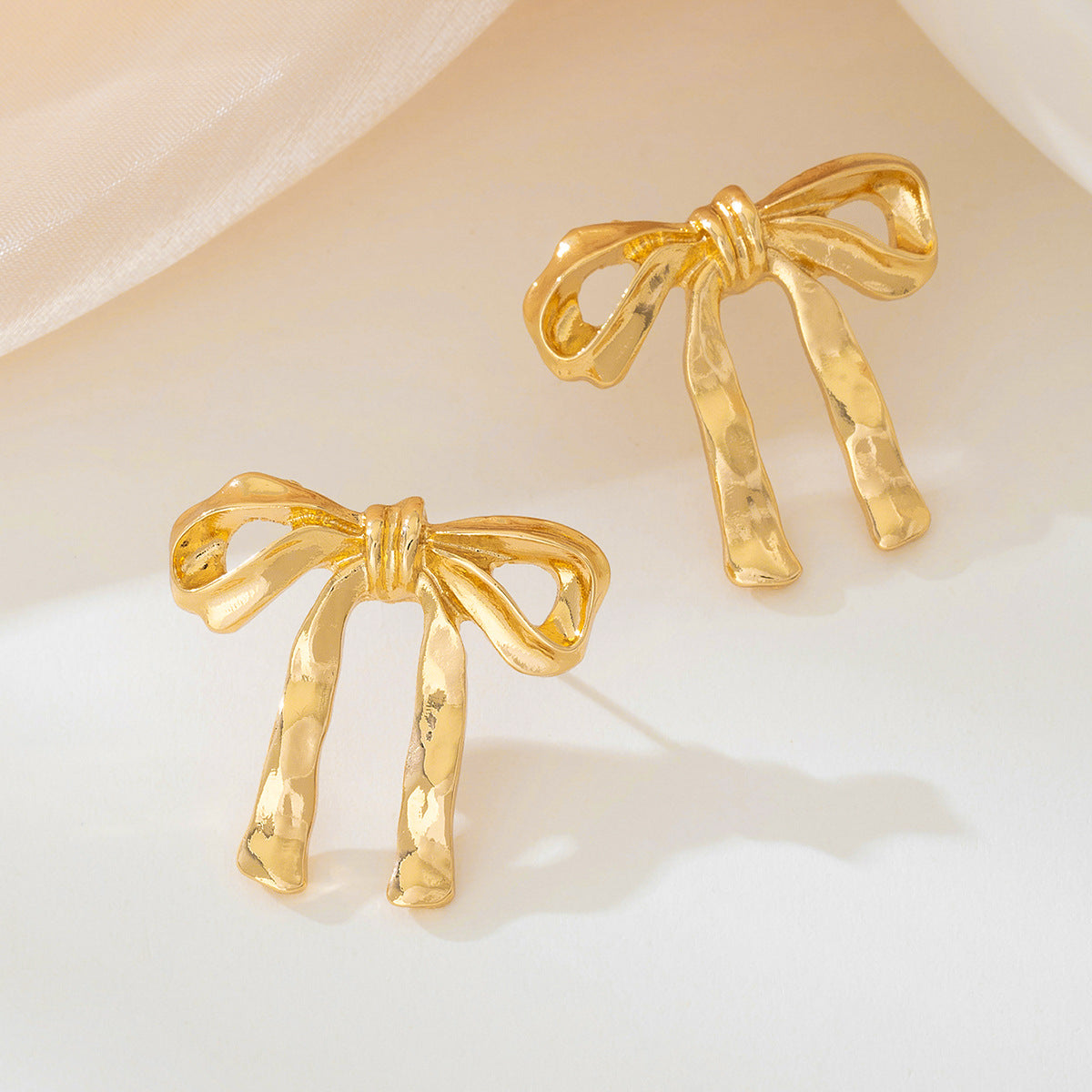 Planderful Vienna Verve Earrings – Exquisite Metal French Bow Design
