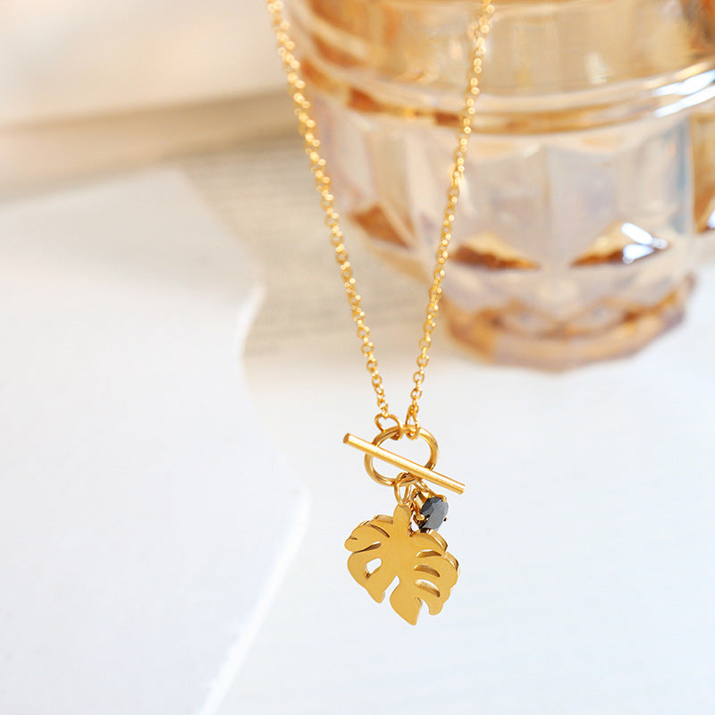 Elegant 18k Gold-Plated Titanium Steel Necklace with Black Zircon Leaf Pendant