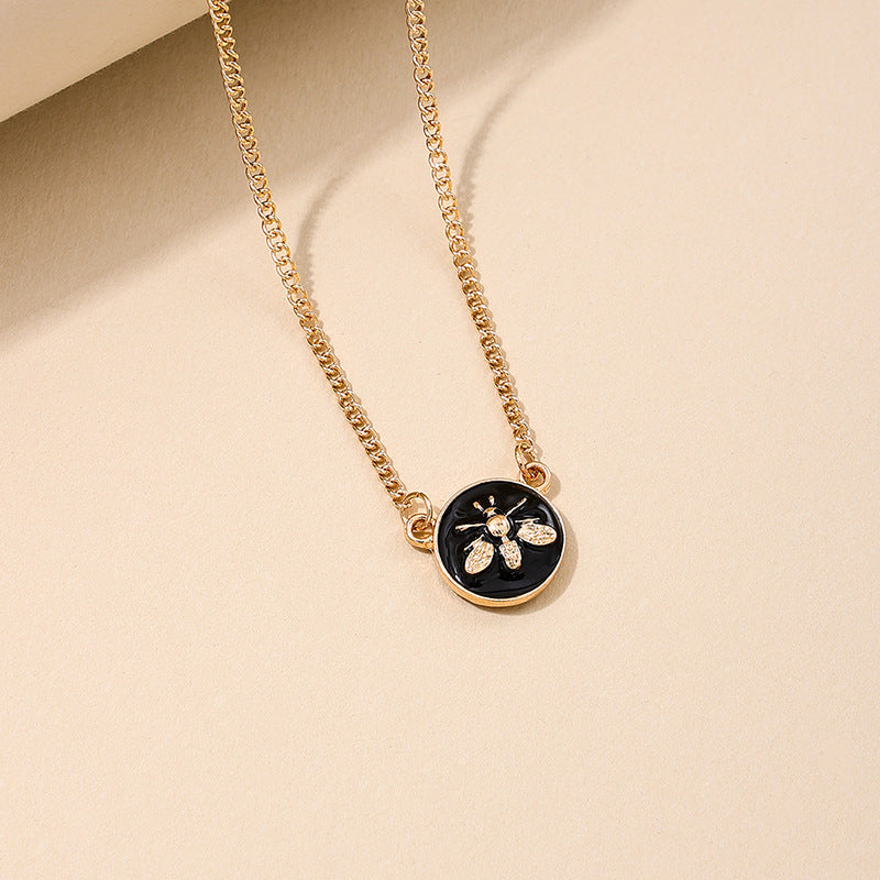 Elegant Black Circle Pendant Necklace with Bee Accent