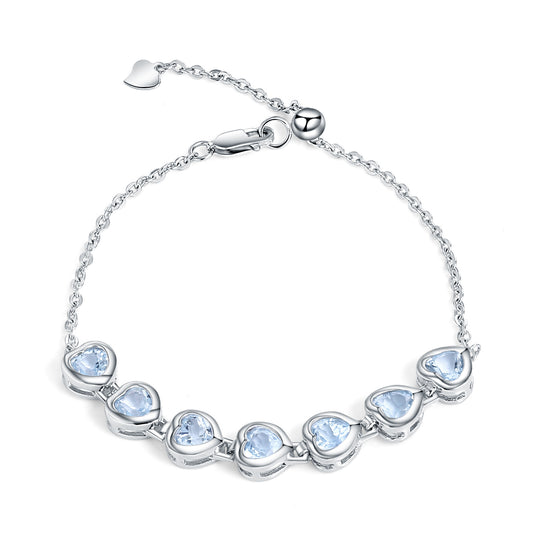 Row of Heart Shape Natural Blue Topaz Silver Bracelet