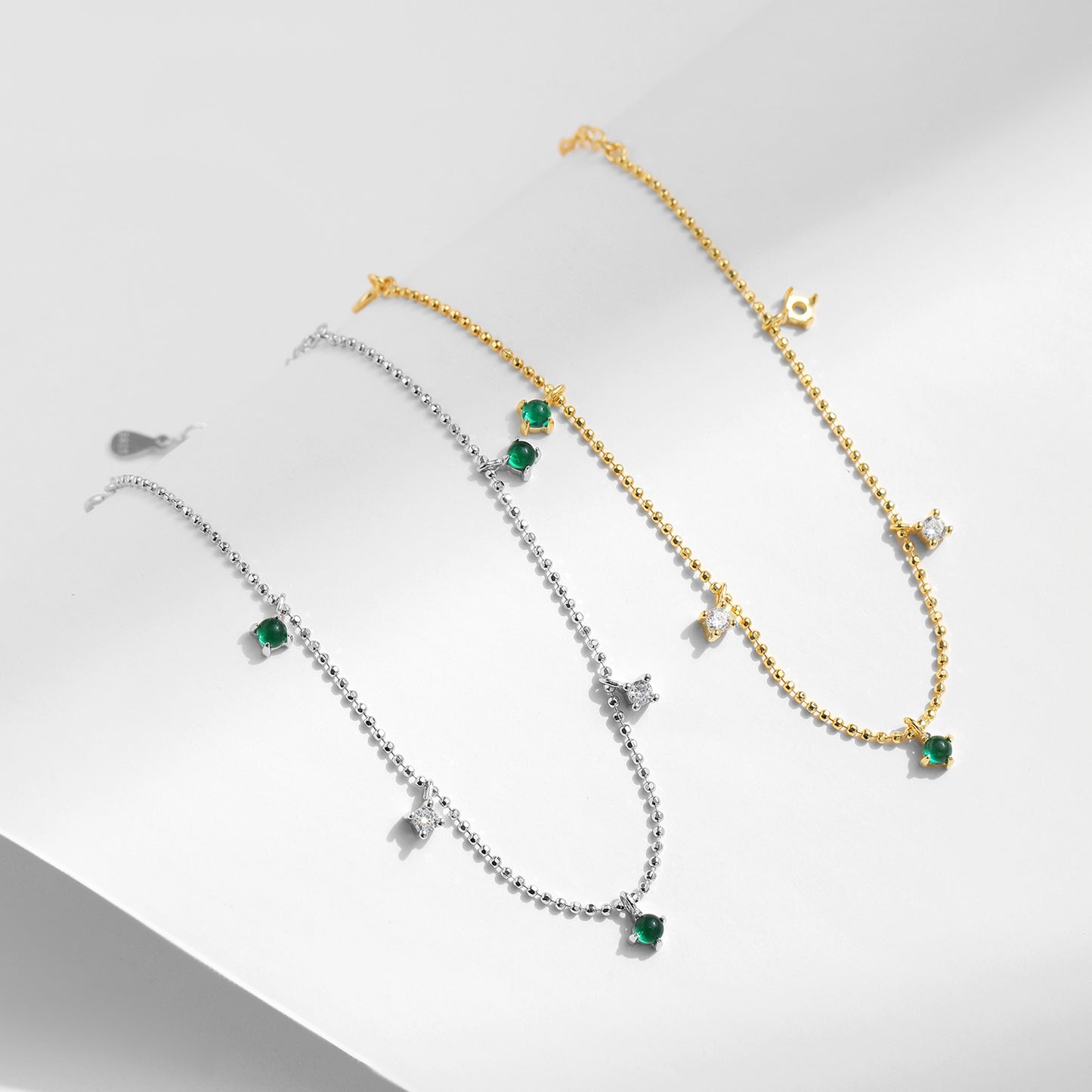 Elegant Sterling Silver Bracelet with Emerald Zircon Accent