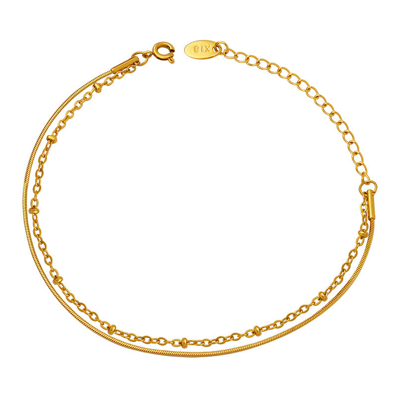Golden Snake Bone Chain Bracelet with Bag Bead Detailing