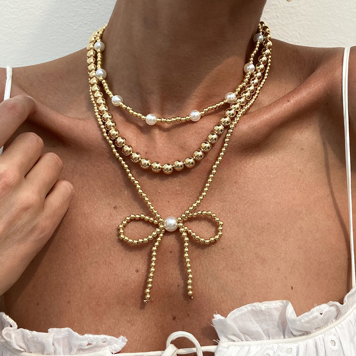 European and American fashion cross-border ins stacking imitation pearl necklace women, French temperament multi-layer bow beaded necklace decoration