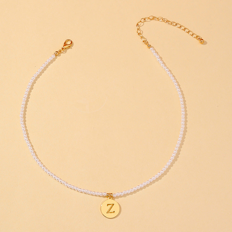 Elegant Hollow English Letter Pendant Necklace with Pearl Accents