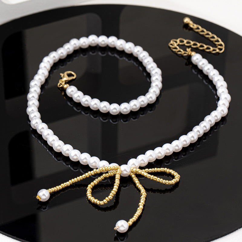 Planderful Vienna Verve Necklace – Exquisite Imitation Pearl Bow Design