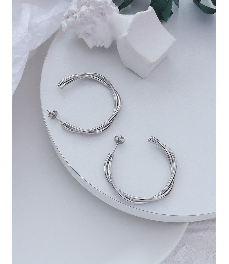 Golden Twist Cross Earrings with Titanium Finish - Unique Genie Collection Piece