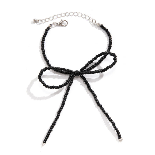 Upscale Beaded Necklace with Pearl Knot and Bow Pendant