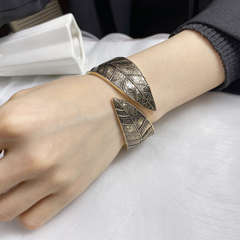 Enchanting Vienna Verve Metal Bracelet with Intricate Leaf Design