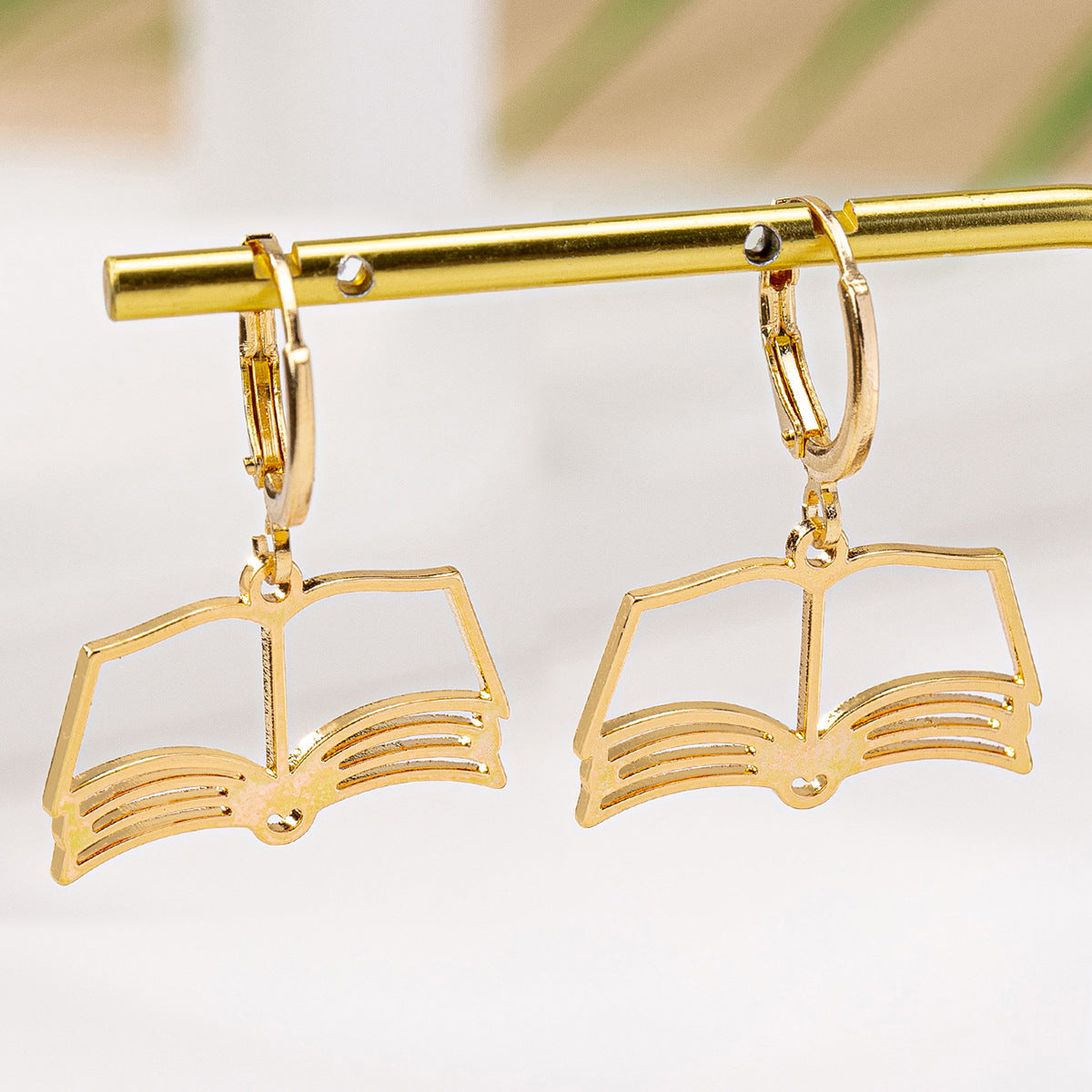 Planderful Vienna Verve Earrings – Stylish Hollow Book Design