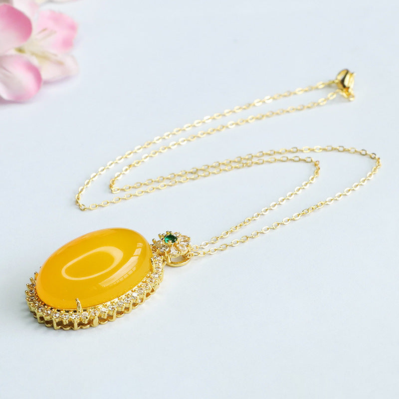 Golden Necklace with Chalcedony Pendant and Zircon Halo