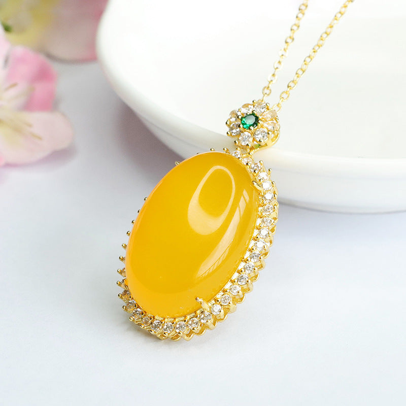 Golden Necklace with Chalcedony Pendant and Zircon Halo