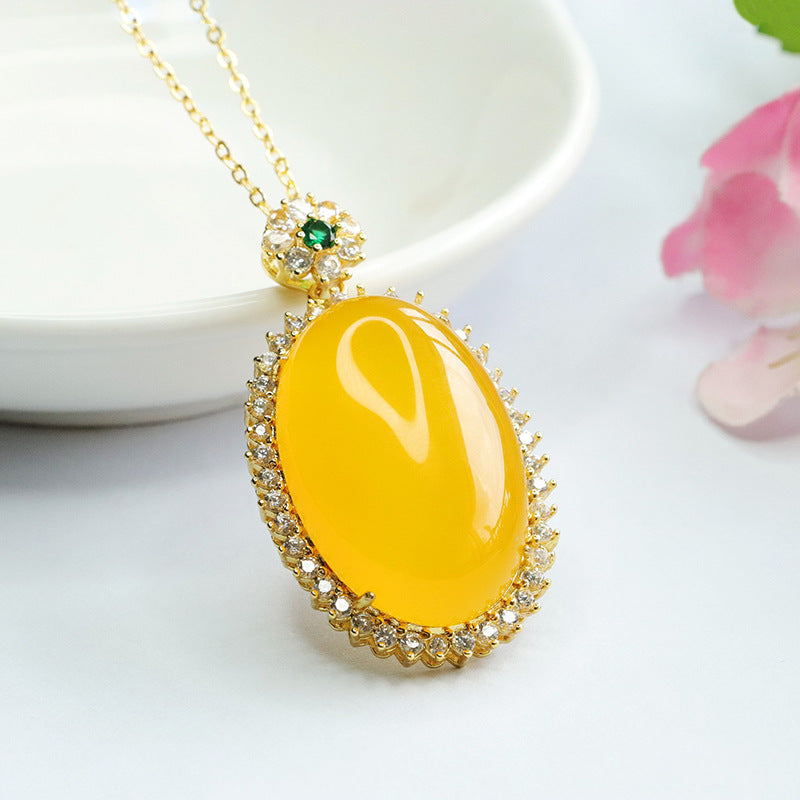 Golden Necklace with Chalcedony Pendant and Zircon Halo