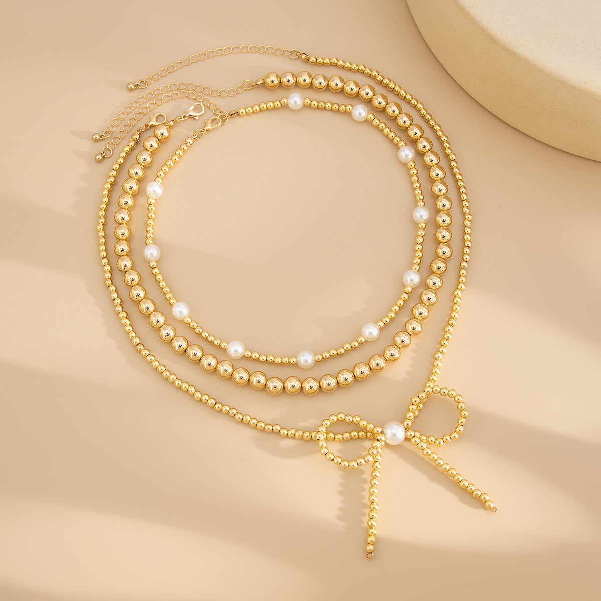 European and American fashion cross-border ins stacking imitation pearl necklace women, French temperament multi-layer bow beaded necklace decoration