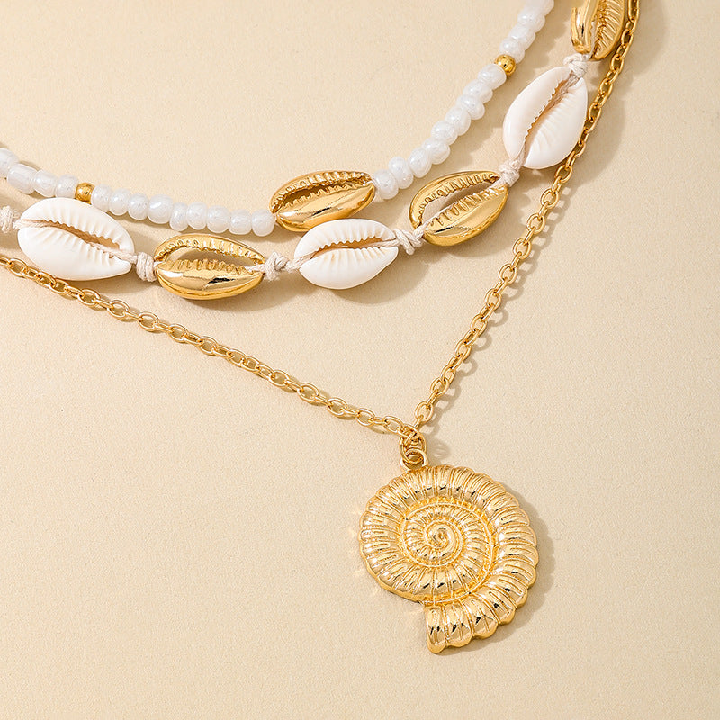 Planderful Vienna Verve Necklace – Beachy Chic Metal Conch Shell Design