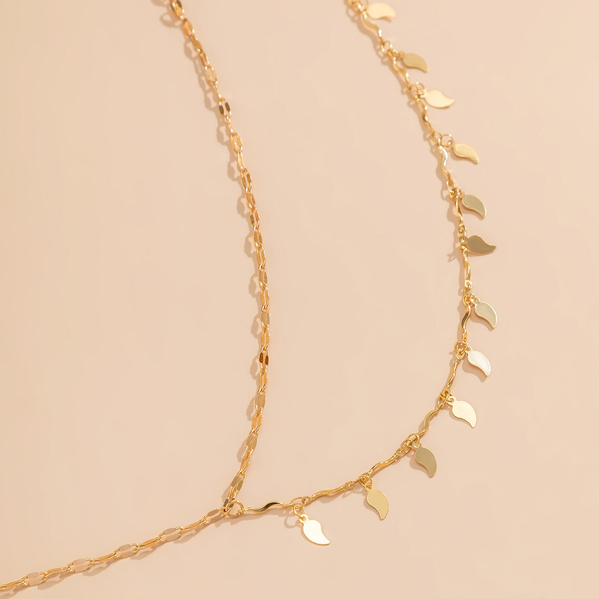 European and American Style Jewelry Set with Fine U-shaped Geometric Body Chain and Metal Leaf Tassel