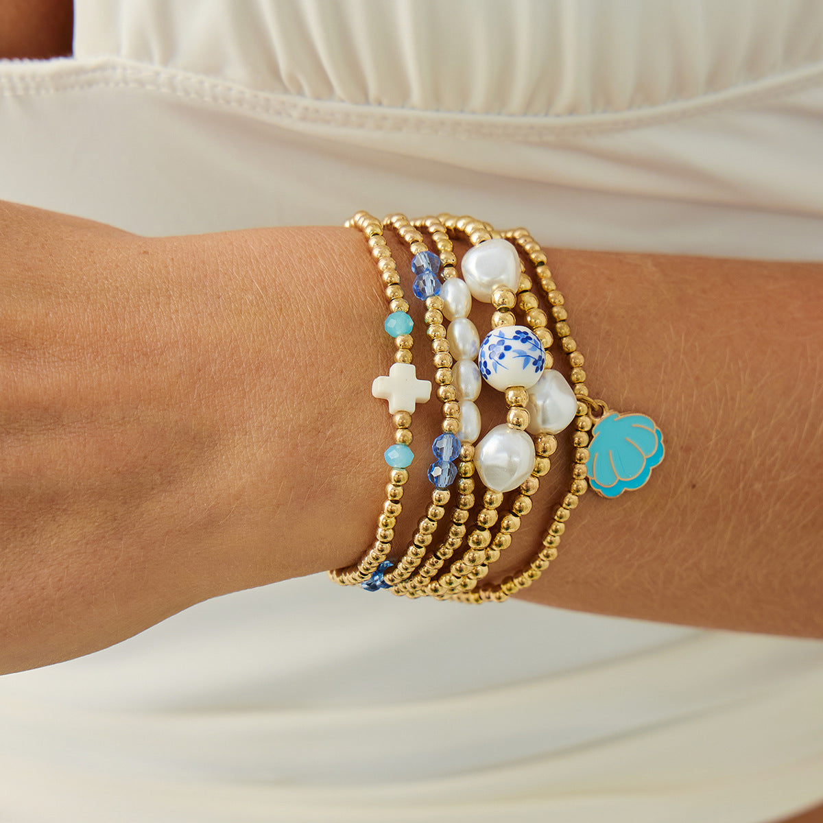 Blue And White Porcelain Beaded Bracelet With Elegant Cross Portrait Pendant For Women By Planderful Vienna Verve