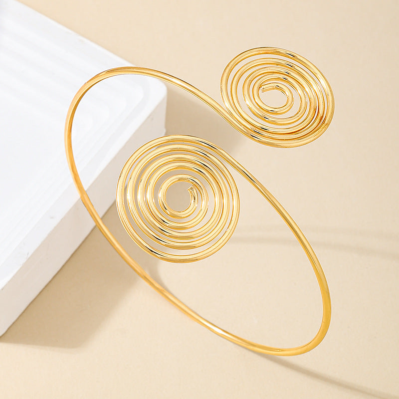 Golden Spiral Arm Ring for Women by Planderful Fashion Statement