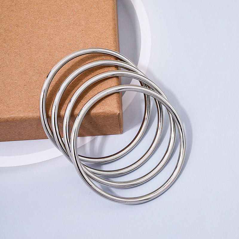 Cross-border Elegance: Vienna Verve Metal Coil Bracelet Set