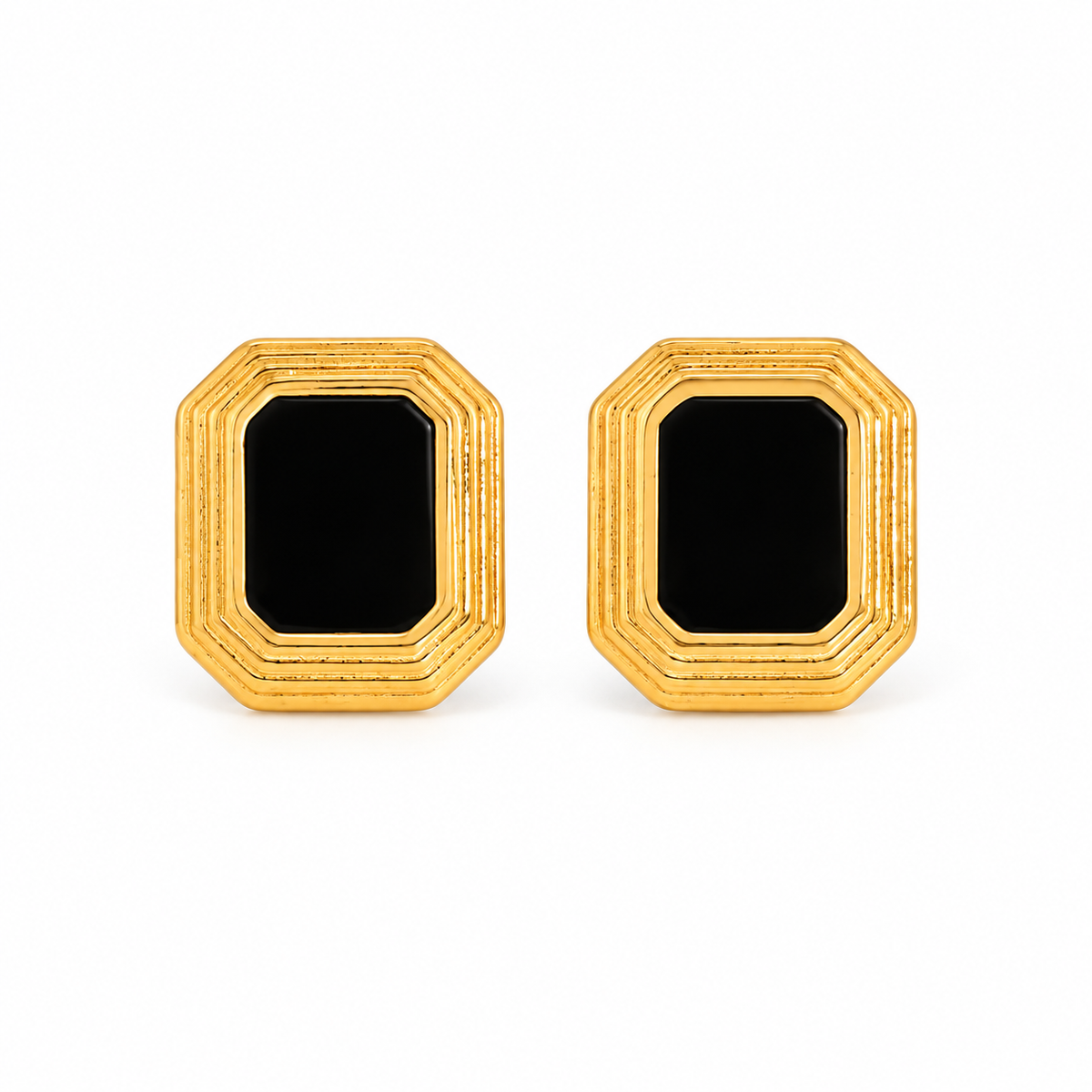 Gold-tone black geometric stud earrings on white background