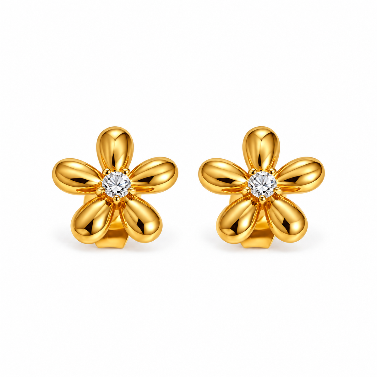 Gold-tone crystal flower stud earrings on white background