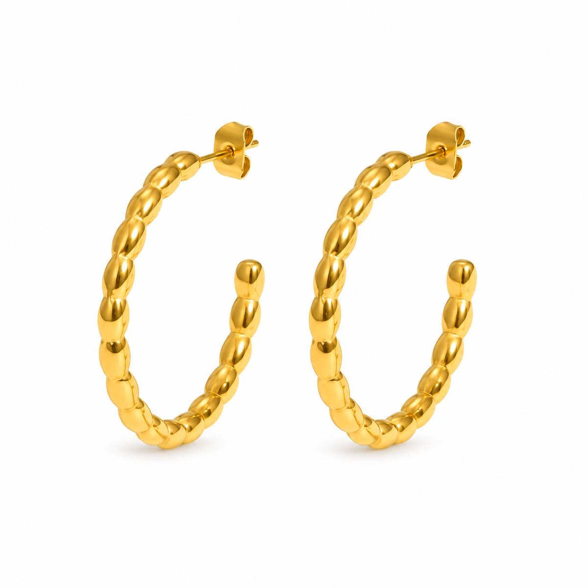 Gold-tone textured open hoop earrings on white background