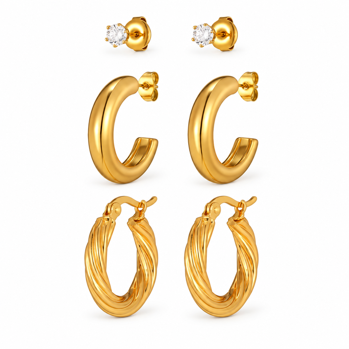 Gold-tone crystal studs and hoop earring styles on white background