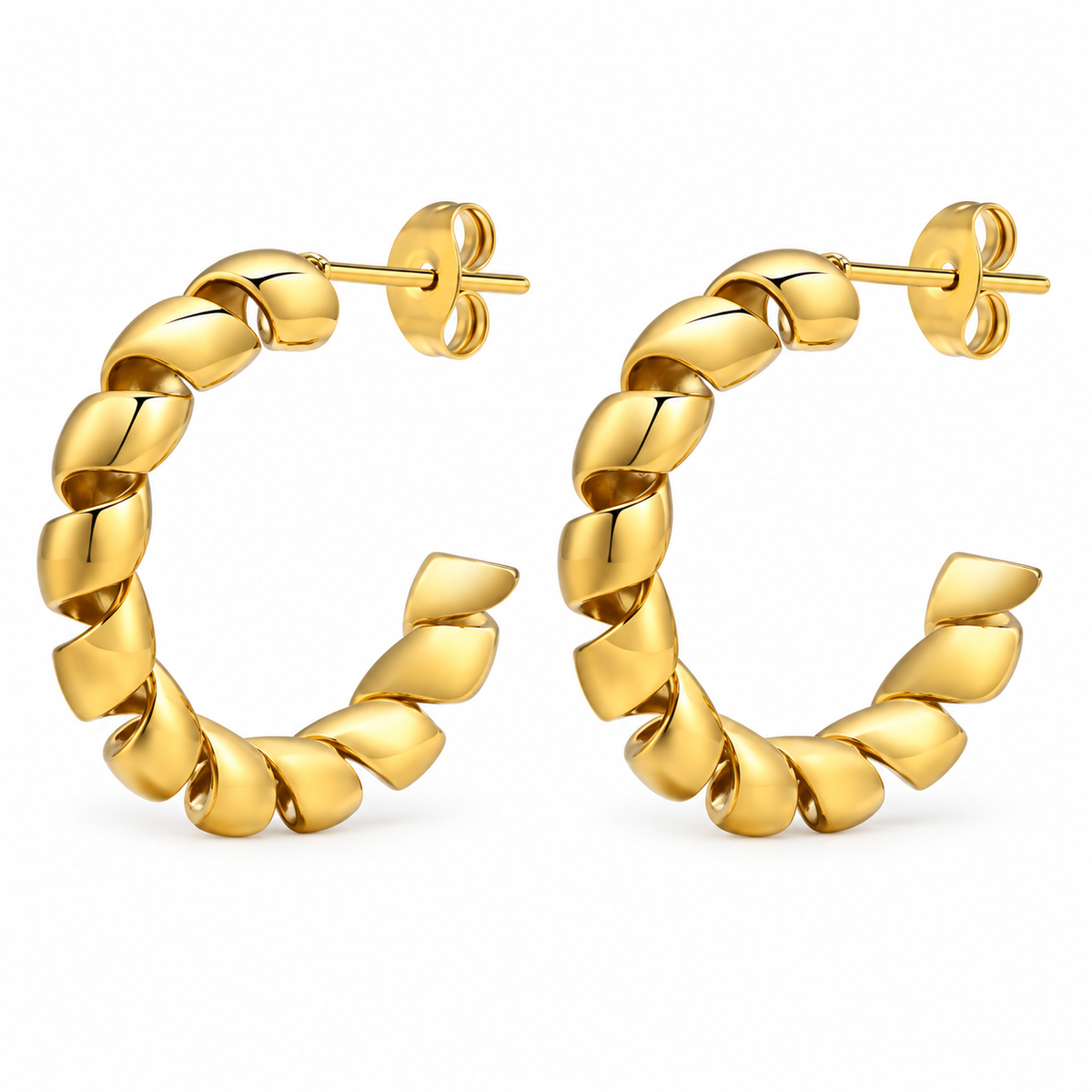 Gold-tone twisted ribbon open hoop earrings on white background