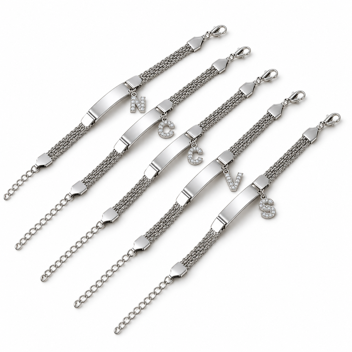 Silver initial chain bracelets on a white background