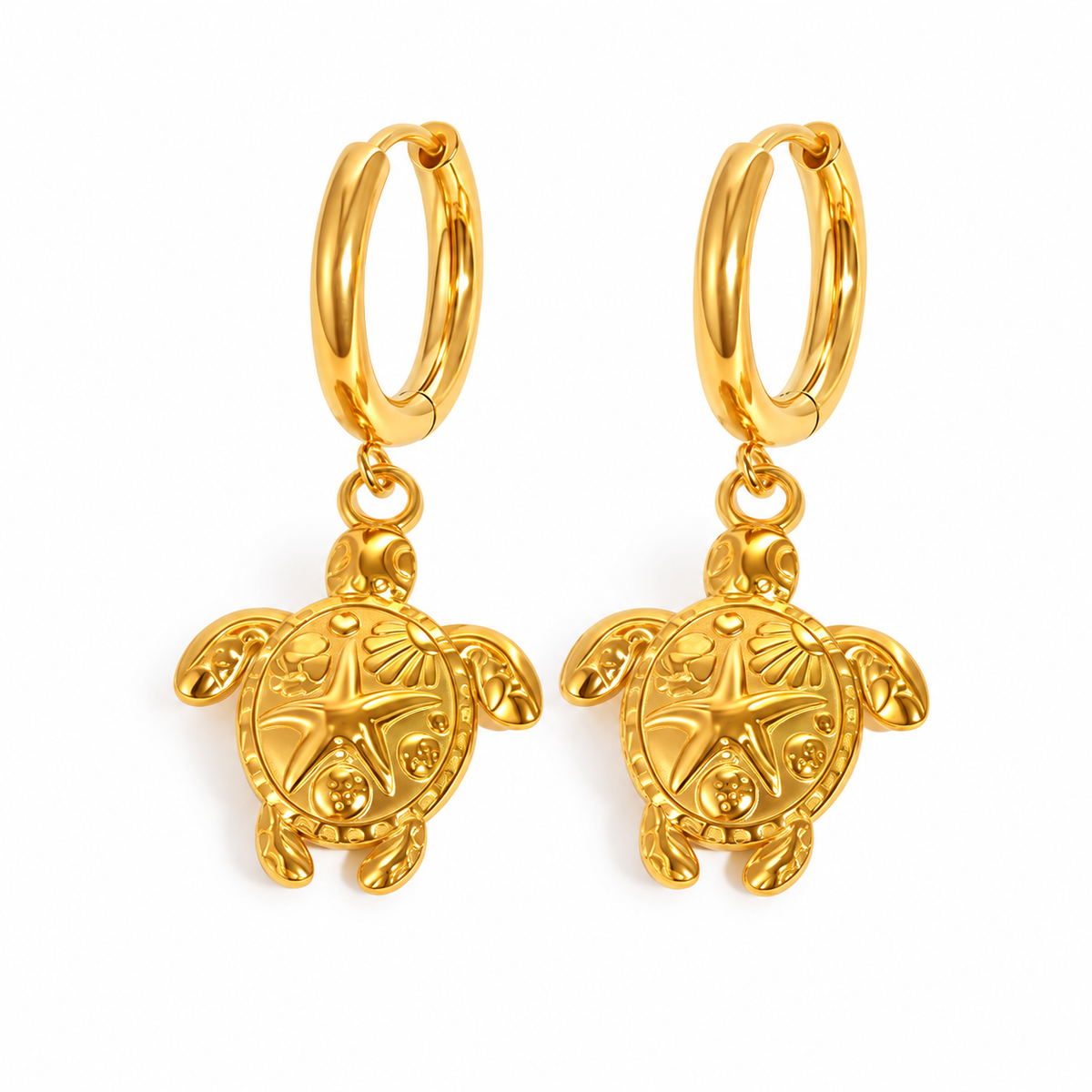 Gold-tone sea turtle huggie hoop earrings on pure white background