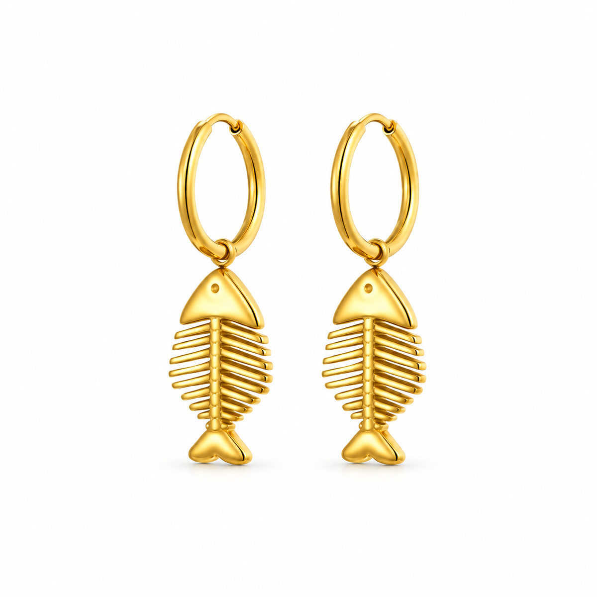 Gold-tone fish skeleton hoop earrings on pure white background