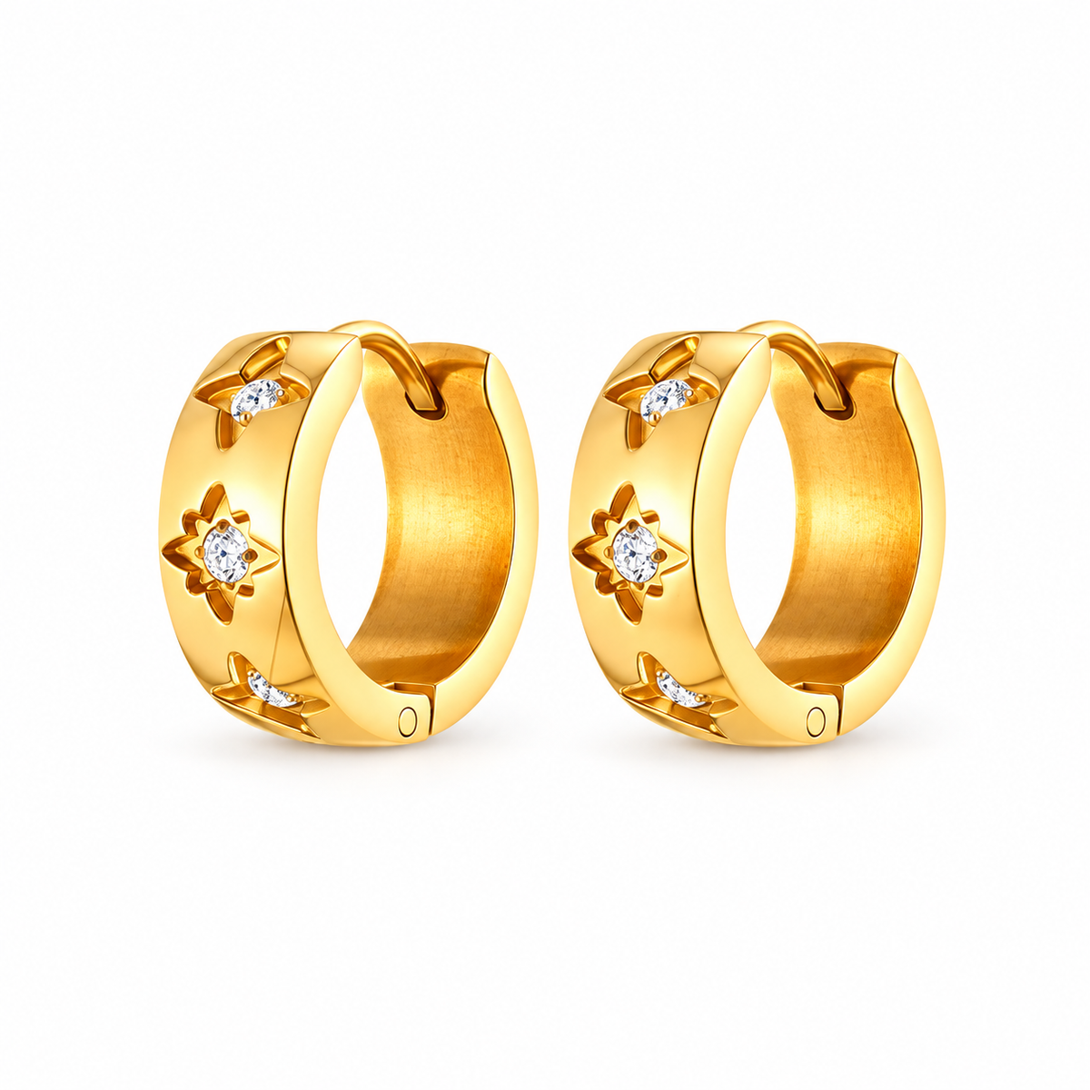 Gold-tone crystal starburst huggie hoop earrings on pure white background