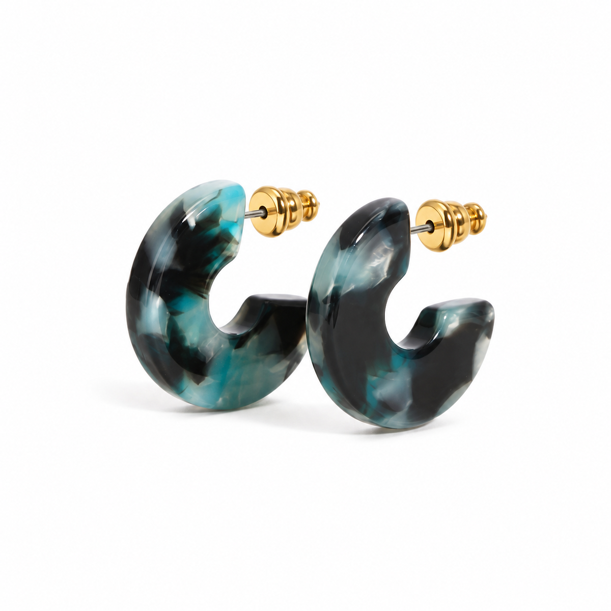 Dark teal marbled resin open hoop earrings on pure white background