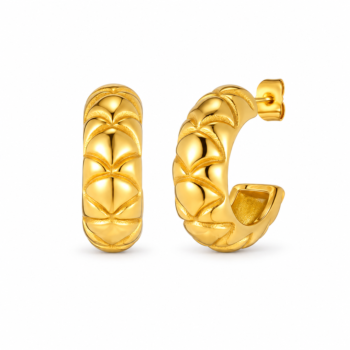 Gold-tone textured scale huggie hoop earrings on pure white background