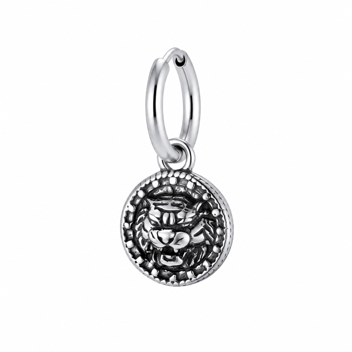Antique silver medallion hoop earring on white background