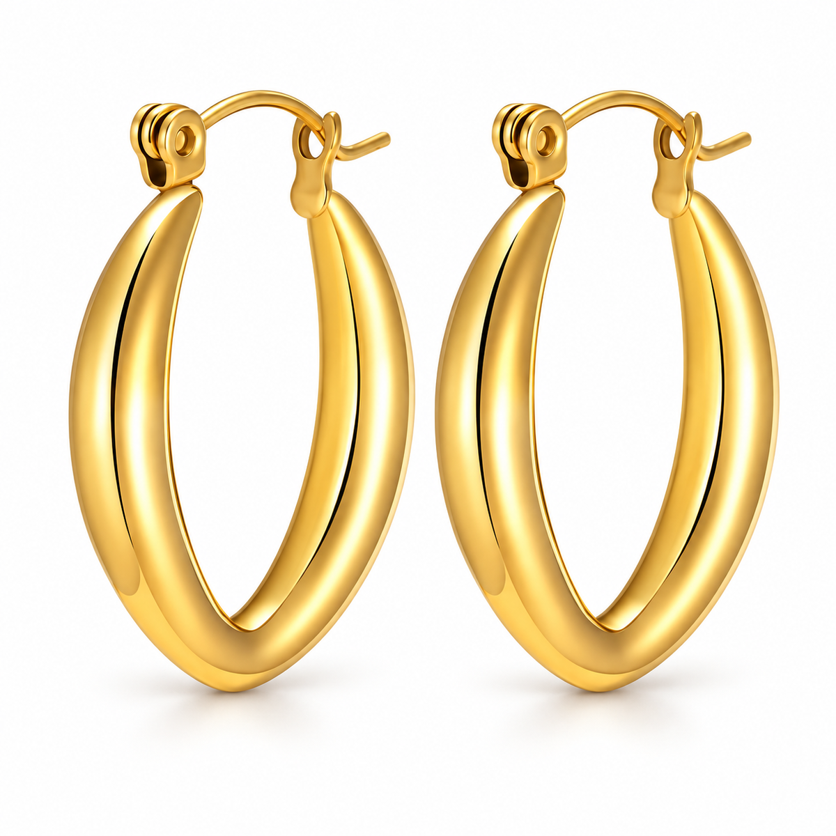 Gold-tone pointed oval sculptural hoop earrings on a pure white background