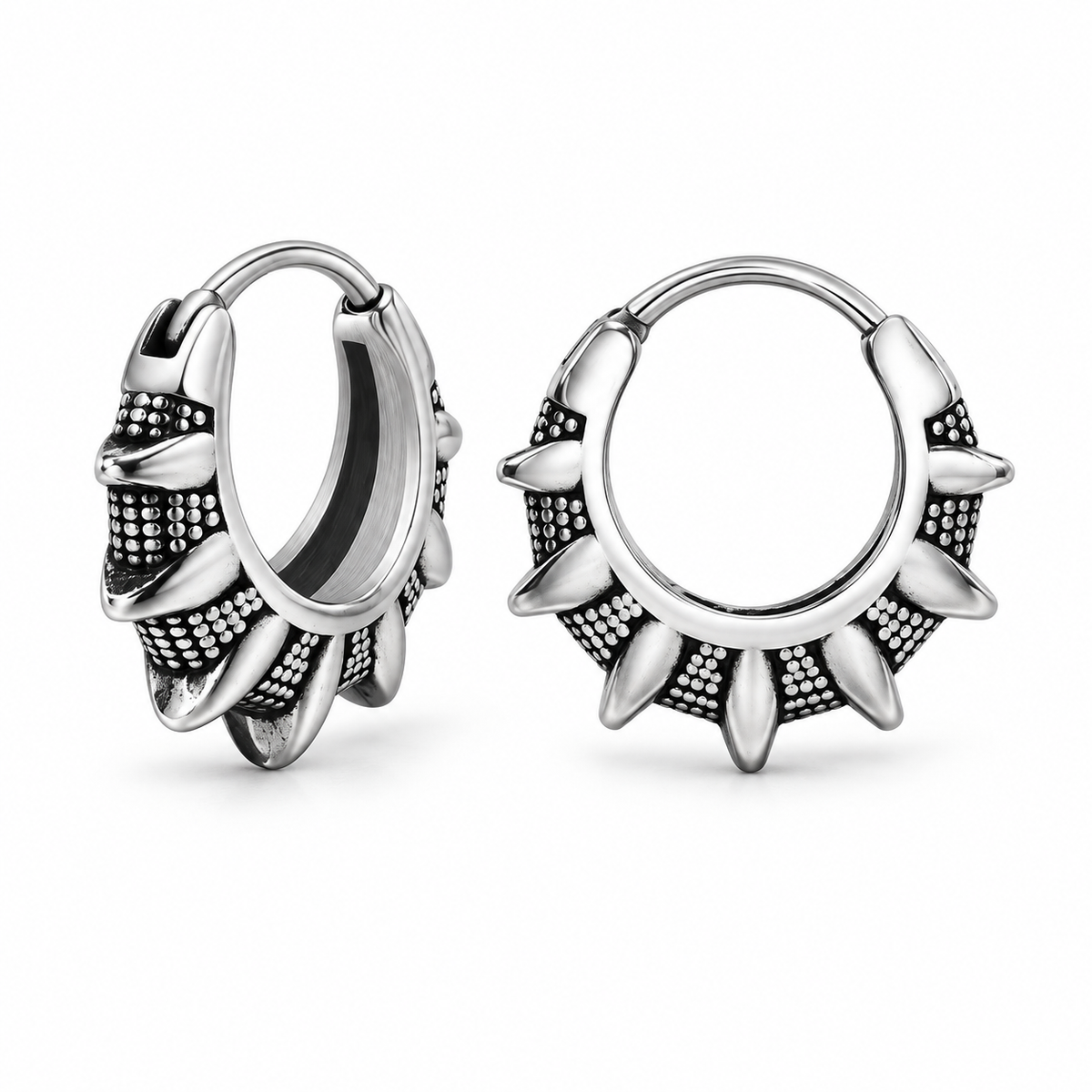 Antique silver tribal sunburst hoop earrings on white background