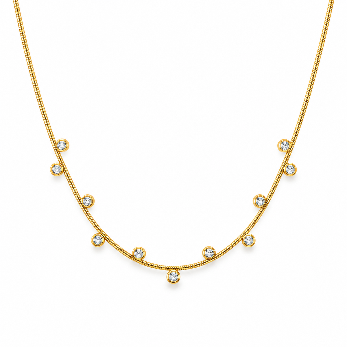 Gold zircon station necklace on white background