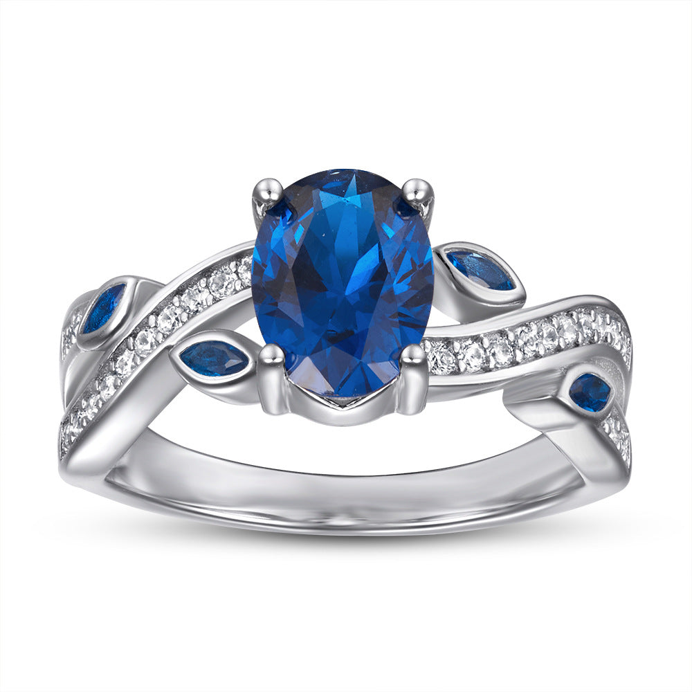 Blue Oval Zircon with Hollow Pattern Silver Ring for Women