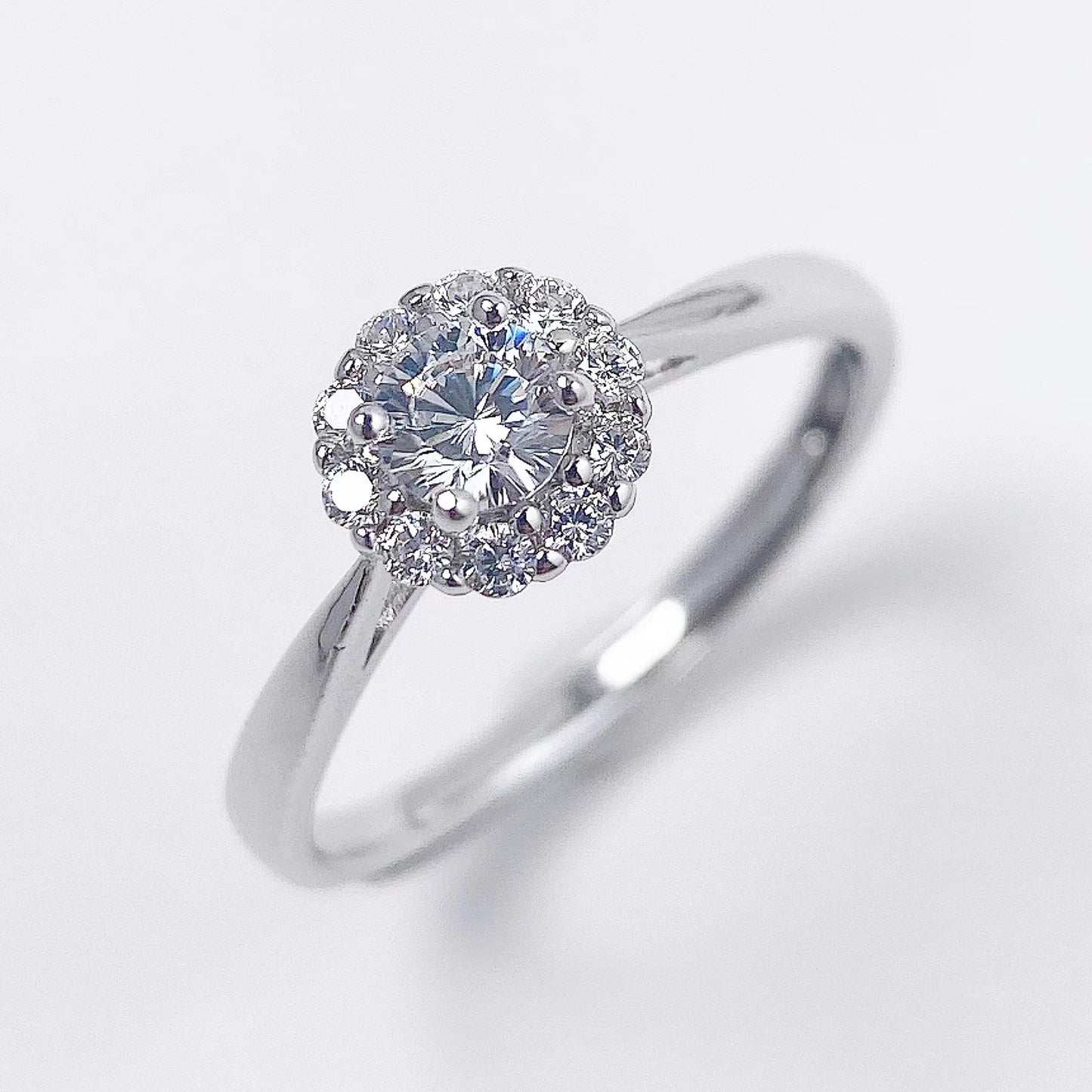 Round Zircon Flower Soleste Halo Silver Ring